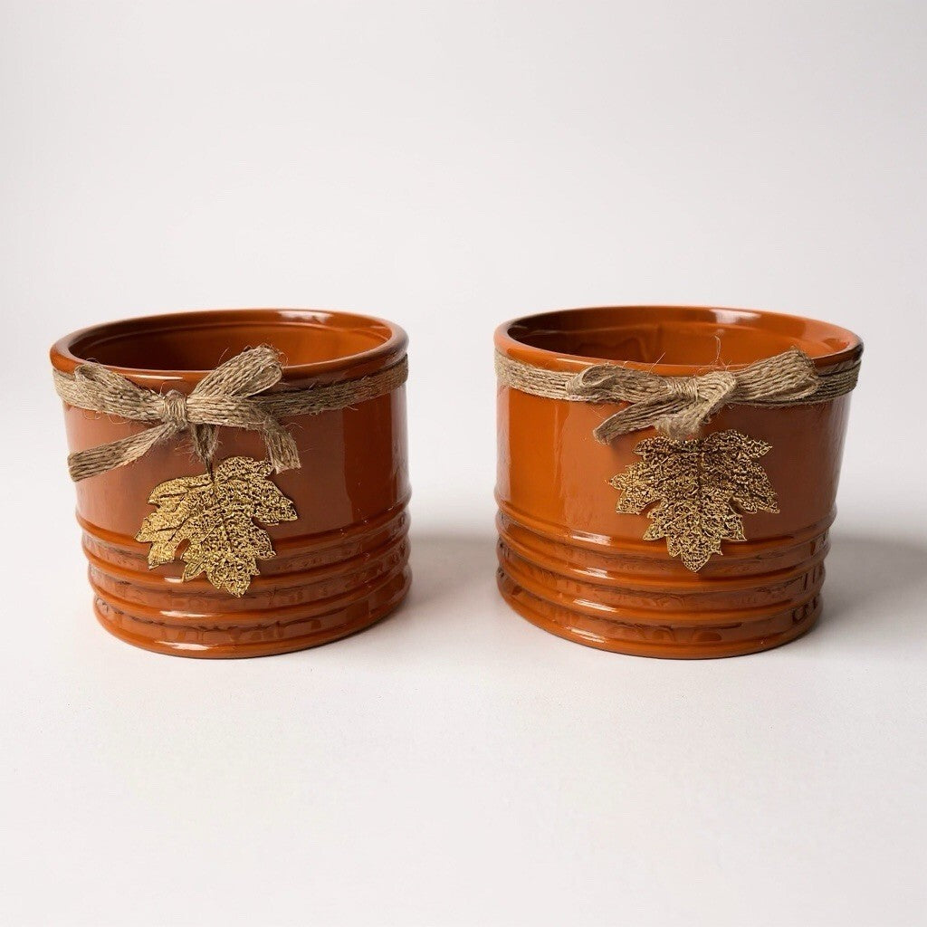 ceramic decorative planters with twine and metal leaf accents