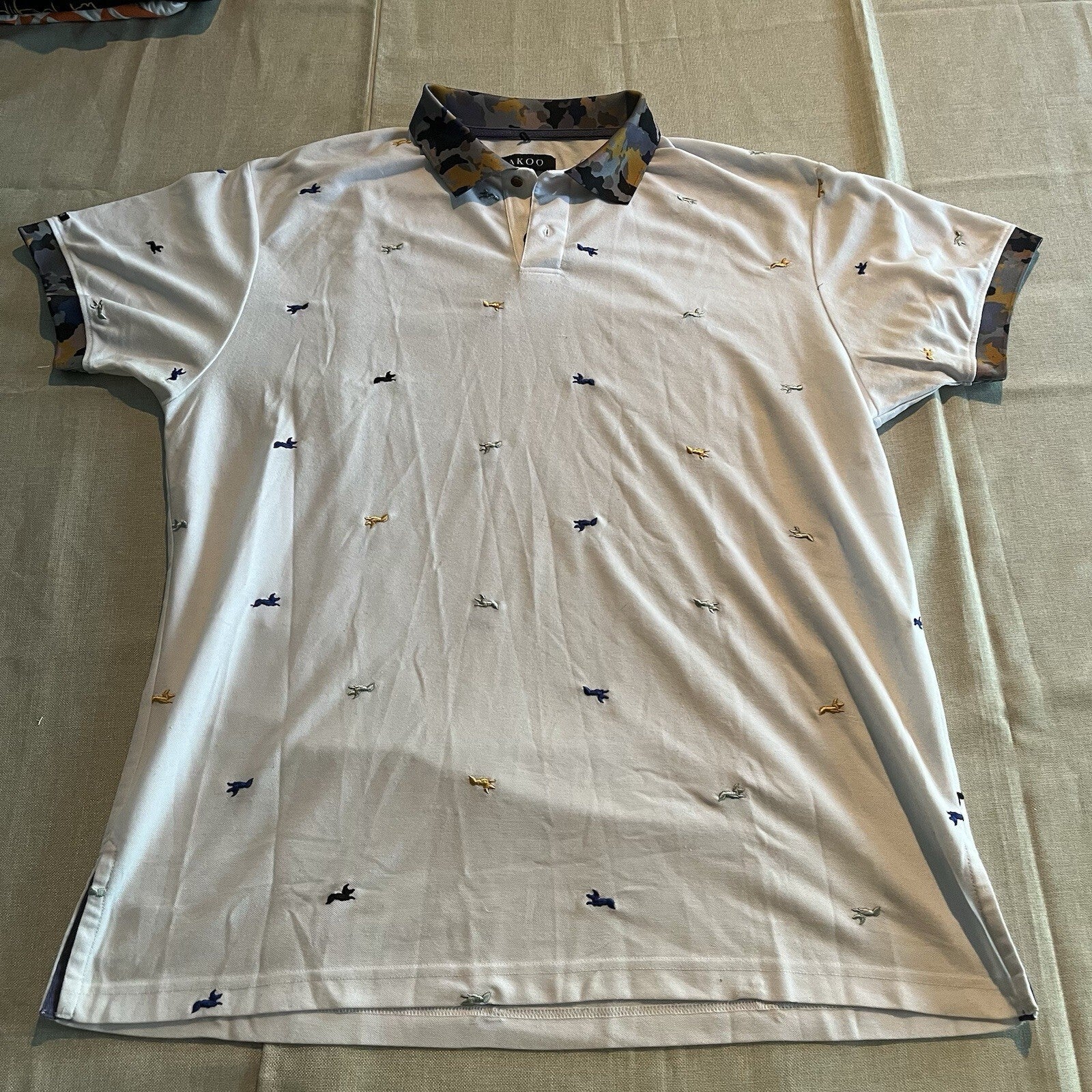 A cool polo shirt with camo collar an accent fox. White 3xl