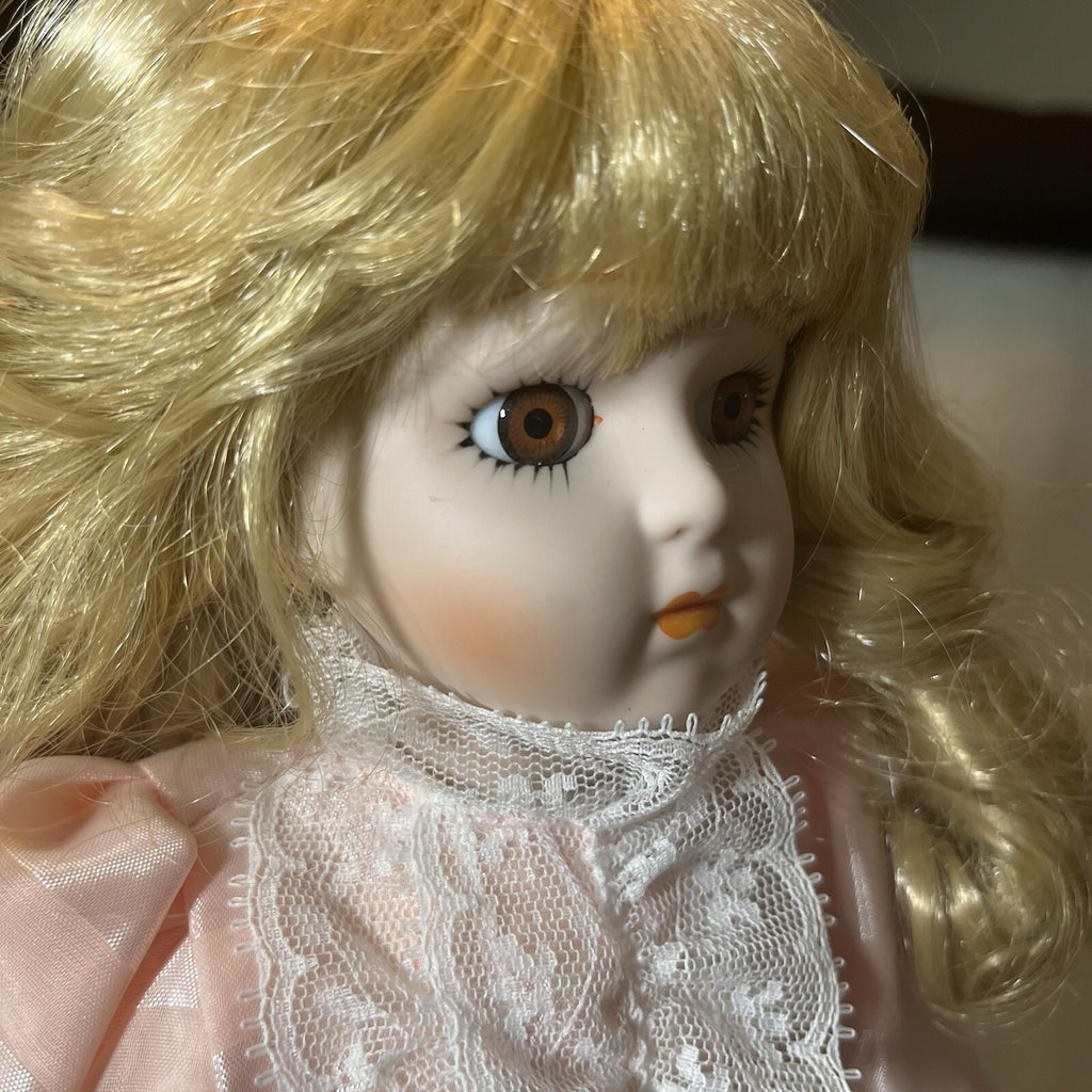 Dynasty doll collection. Porcelain Doll pink Ruffle dress.  17”