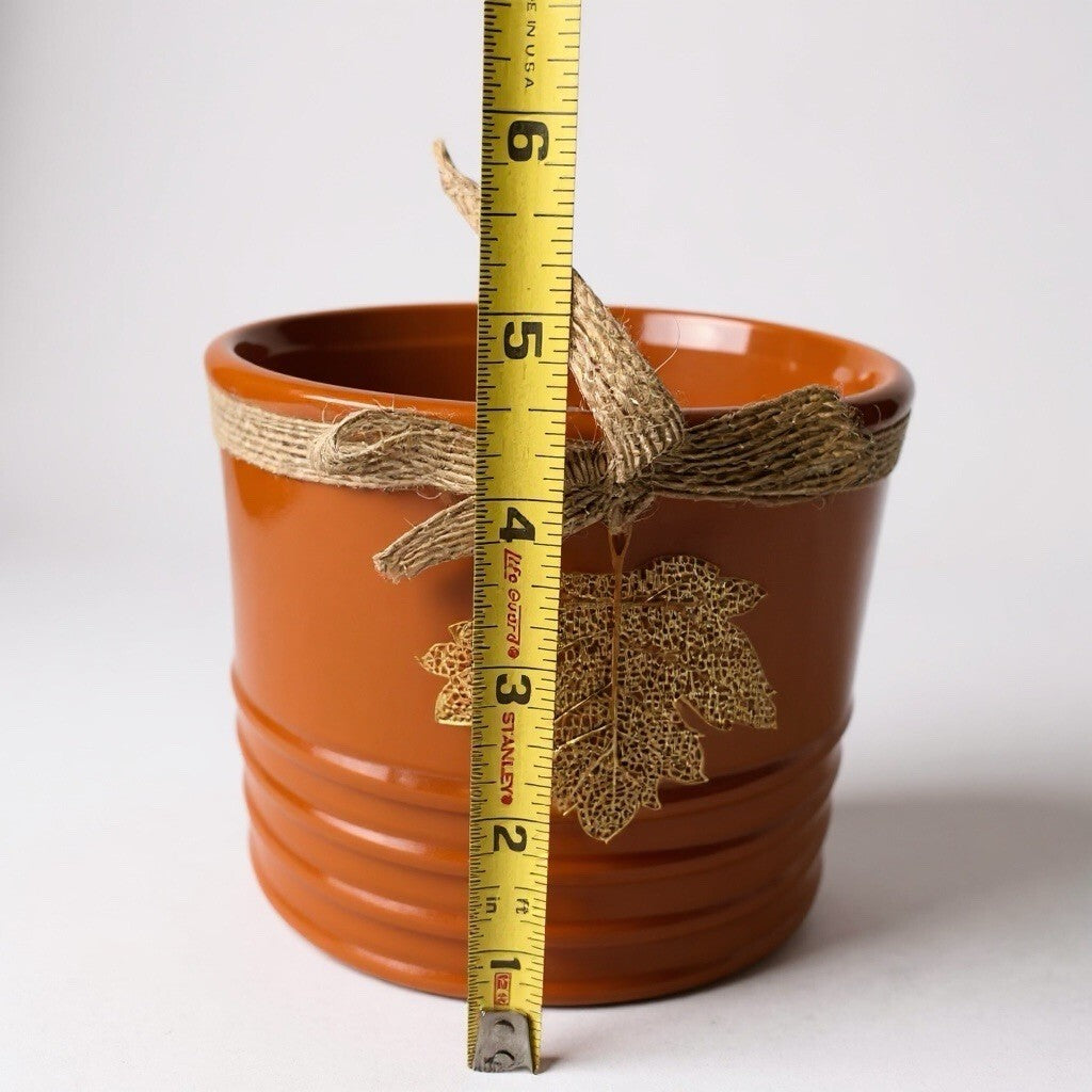 ceramic decorative planters with twine and metal leaf accents