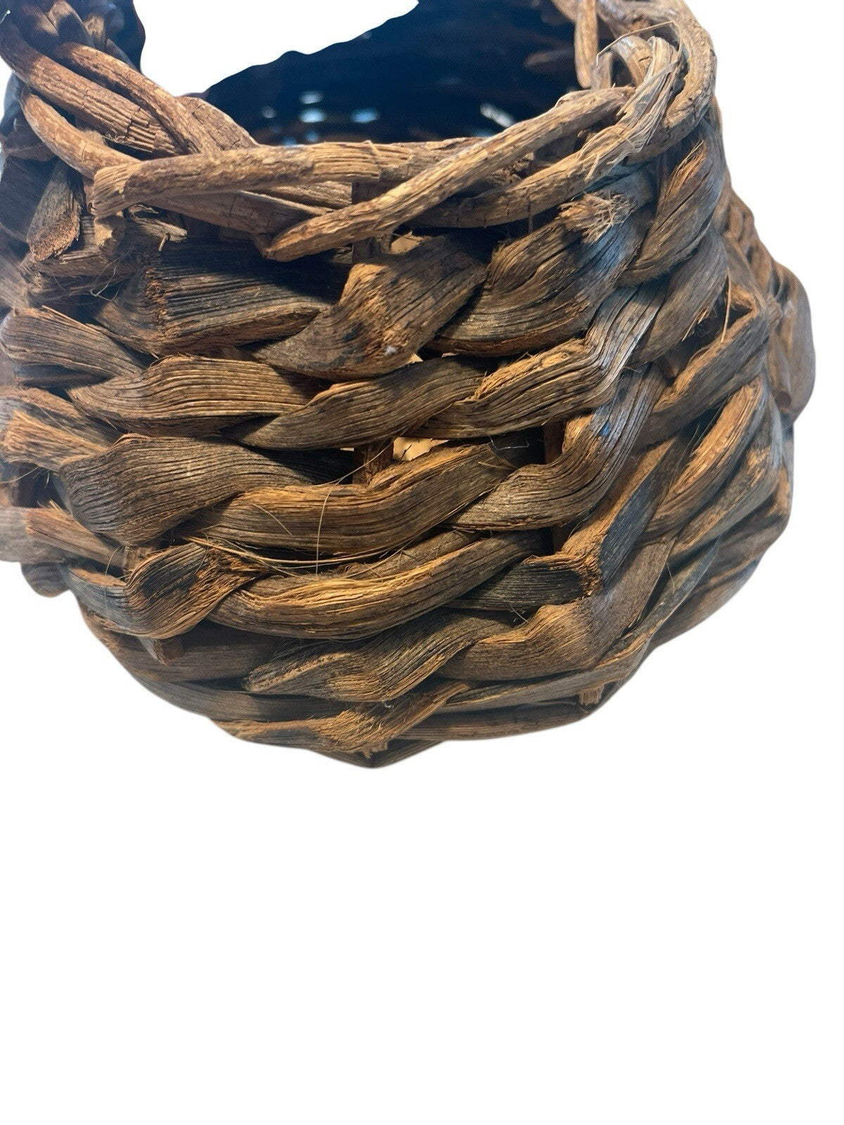 Rustic Hand Woven Basket Made From Natural Materials In An Oval Shape