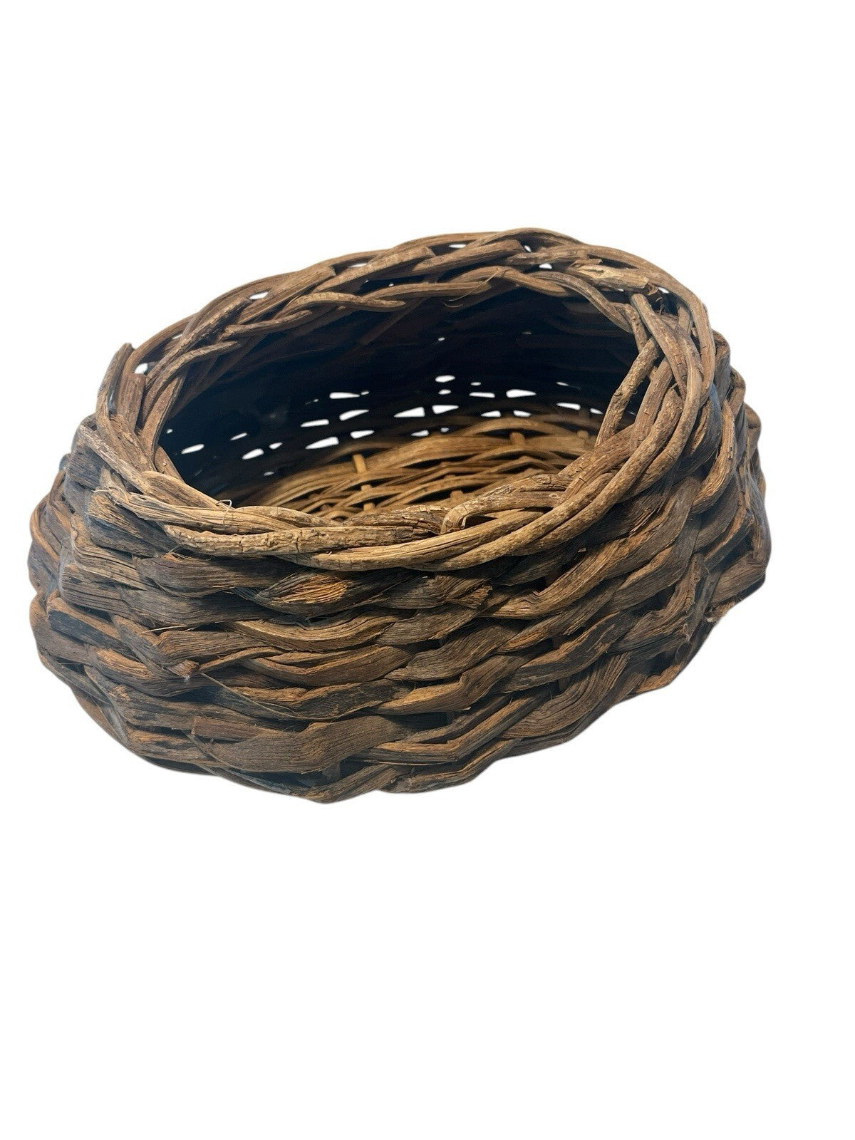 Rustic Hand Woven Basket Made From Natural Materials In An Oval Shape