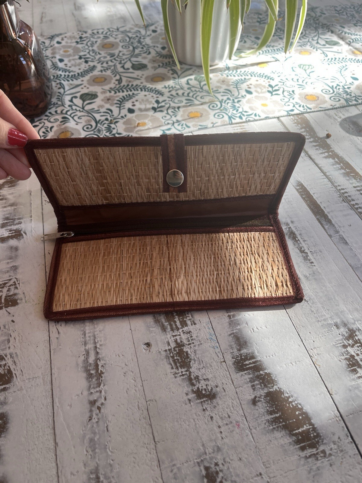 Bohemian style woven straw clutch, with snap closure and embroidered design