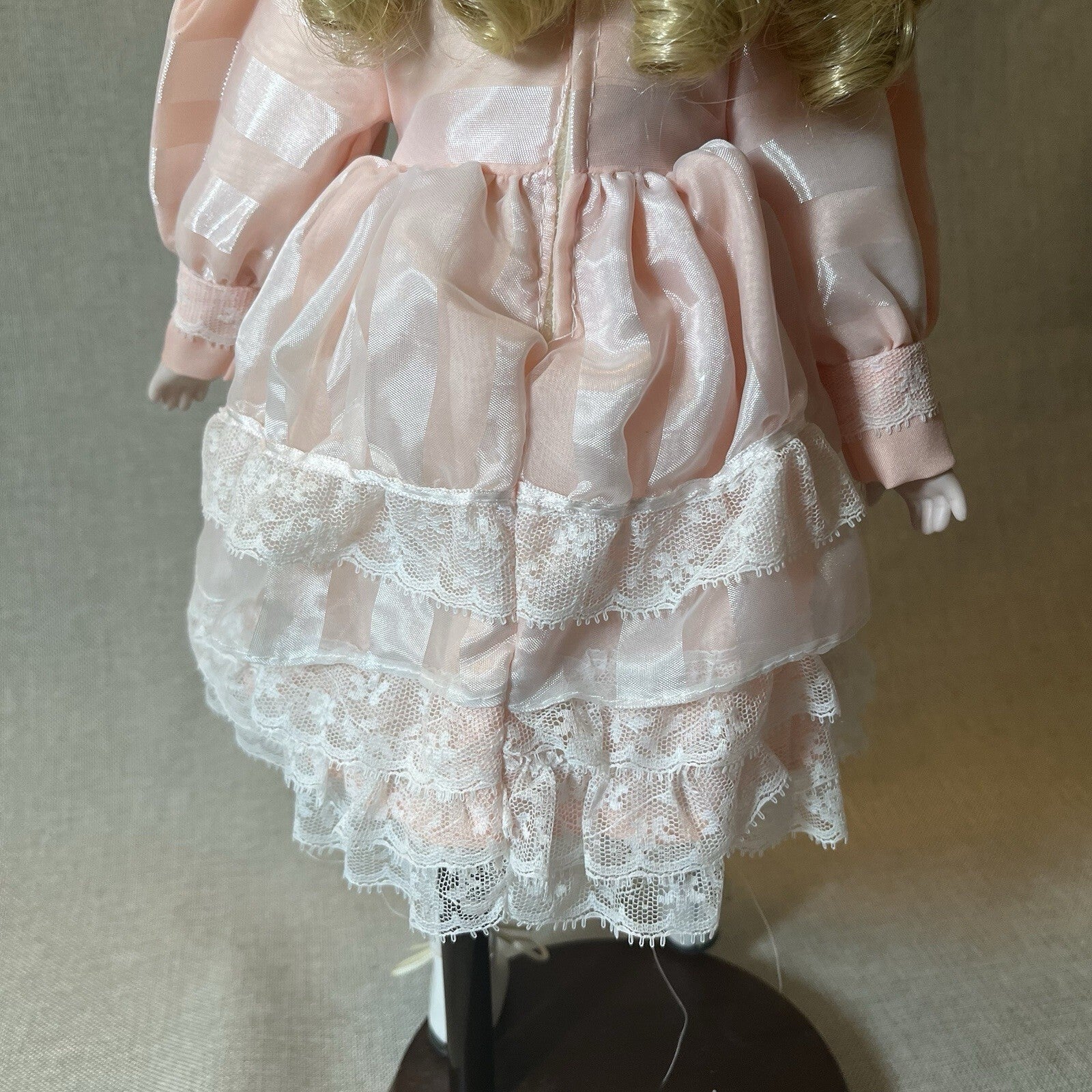 Dynasty doll collection. Porcelain Doll pink Ruffle dress.  17”