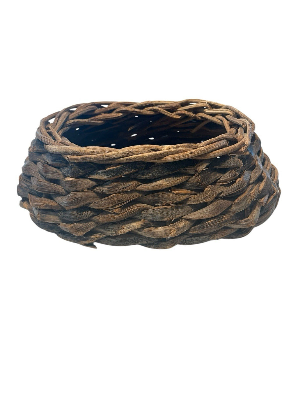 Rustic Hand Woven Basket Made From Natural Materials In An Oval Shape