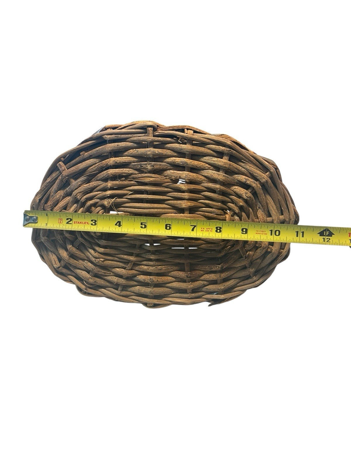 Rustic Hand Woven Basket Made From Natural Materials In An Oval Shape