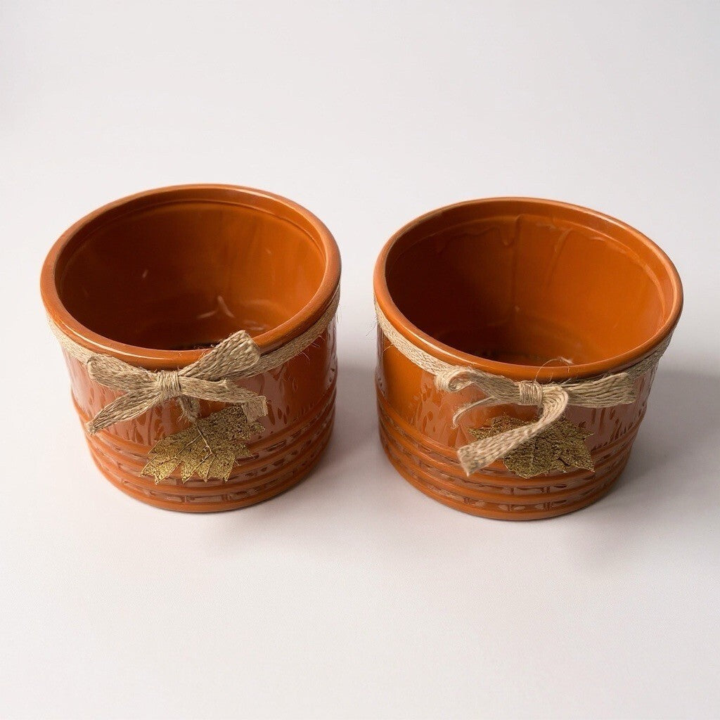 ceramic decorative planters with twine and metal leaf accents