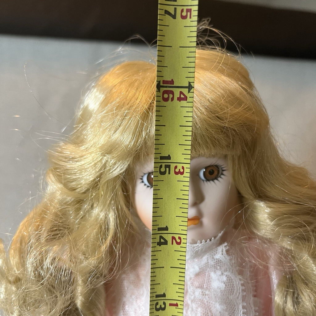 Dynasty doll collection. Porcelain Doll pink Ruffle dress.  17”