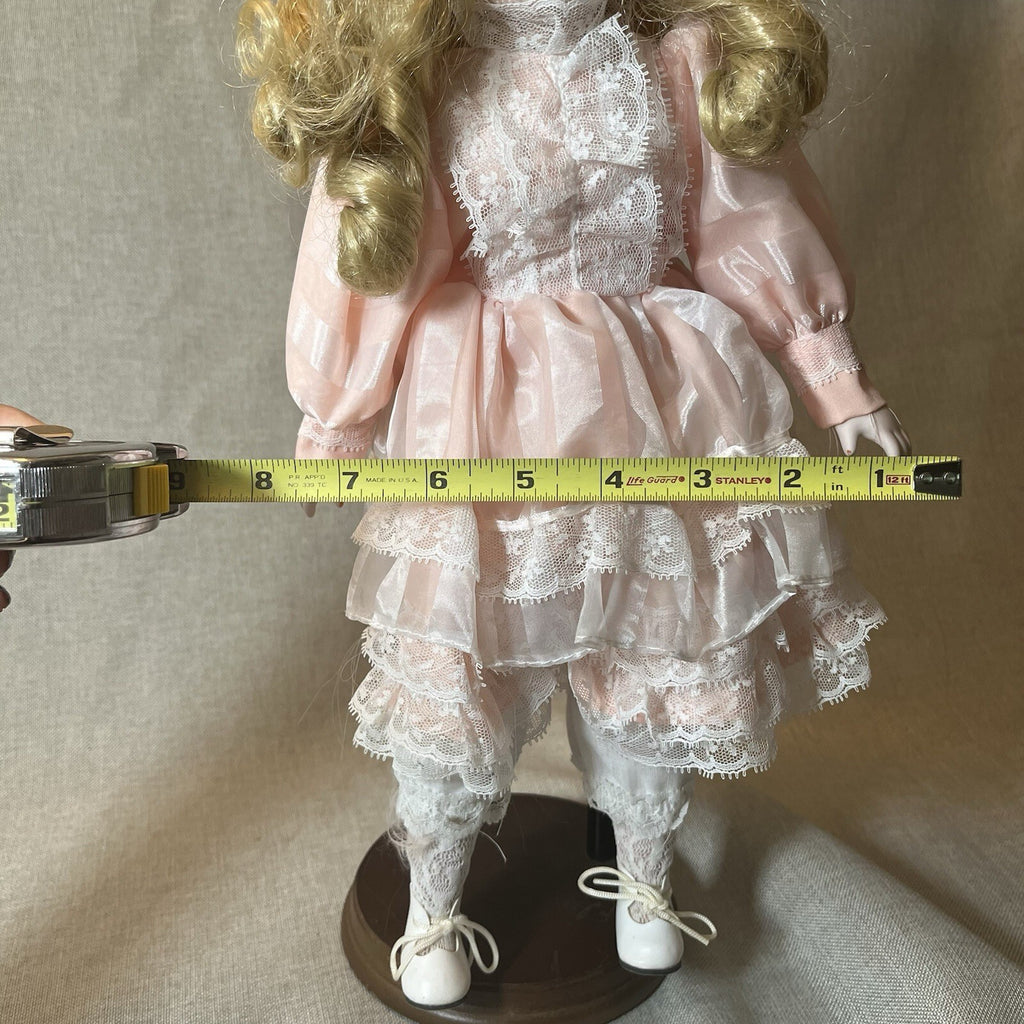 Dynasty doll collection. Porcelain Doll pink Ruffle dress.  17”