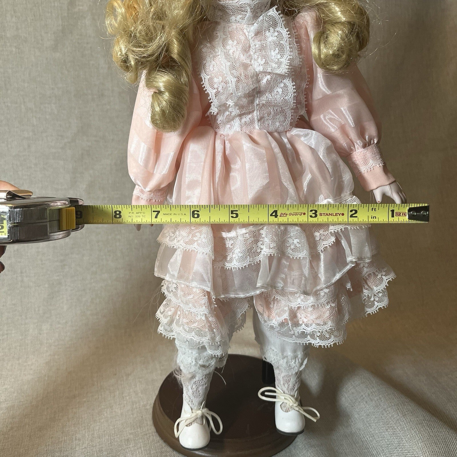 Dynasty doll collection. Porcelain Doll pink Ruffle dress.  17”