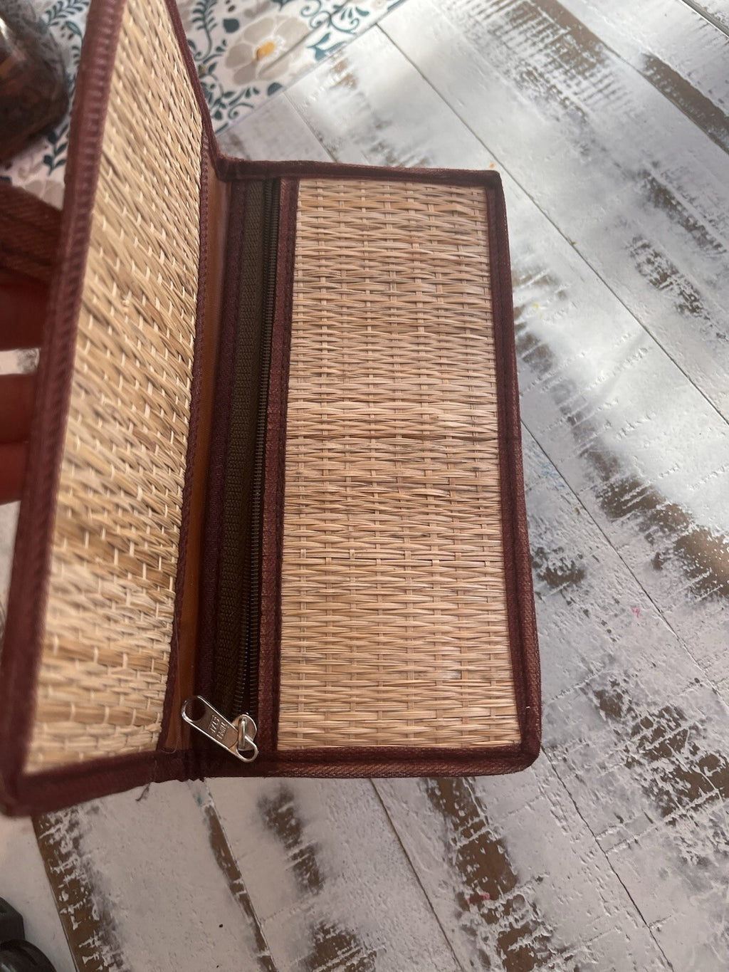 Bohemian style woven straw clutch, with snap closure and embroidered design