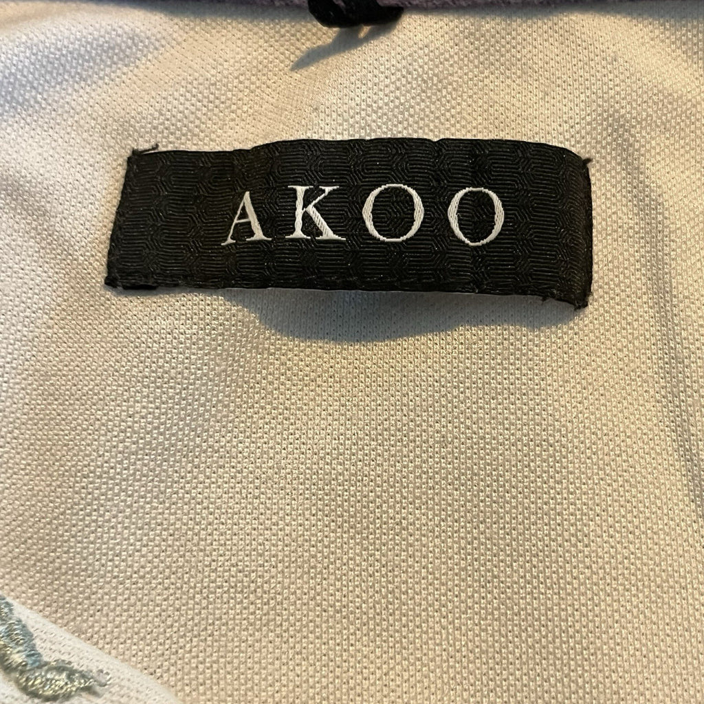 A cool polo shirt with camo collar an accent fox. White 3xl