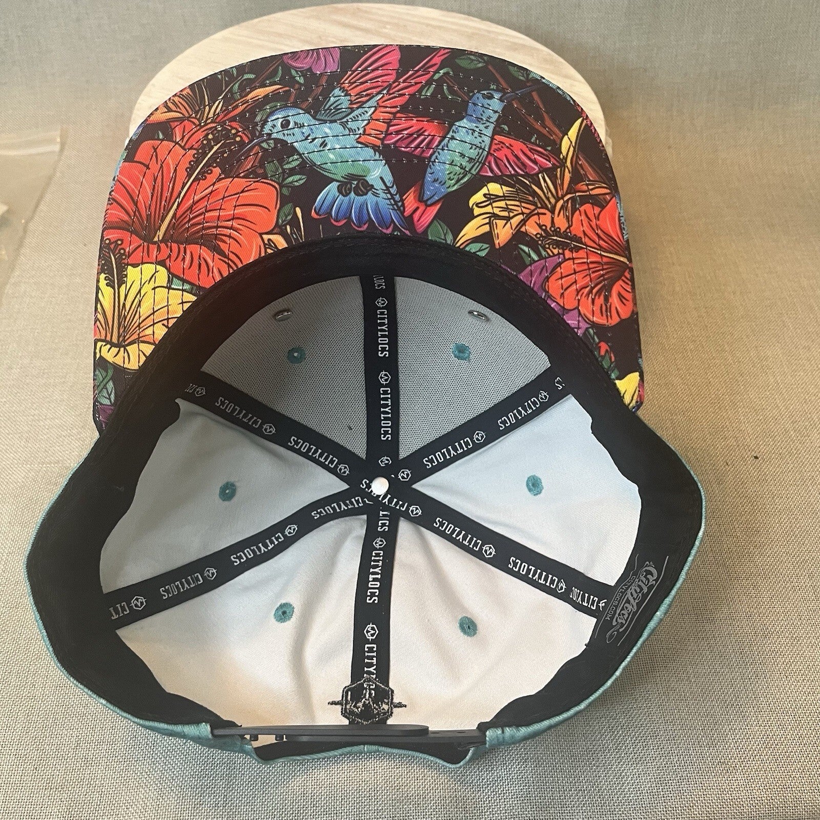 ADJUSTABLE SNAPBACK Hat Citylocs. Hummingbird print with front patch Joycicle