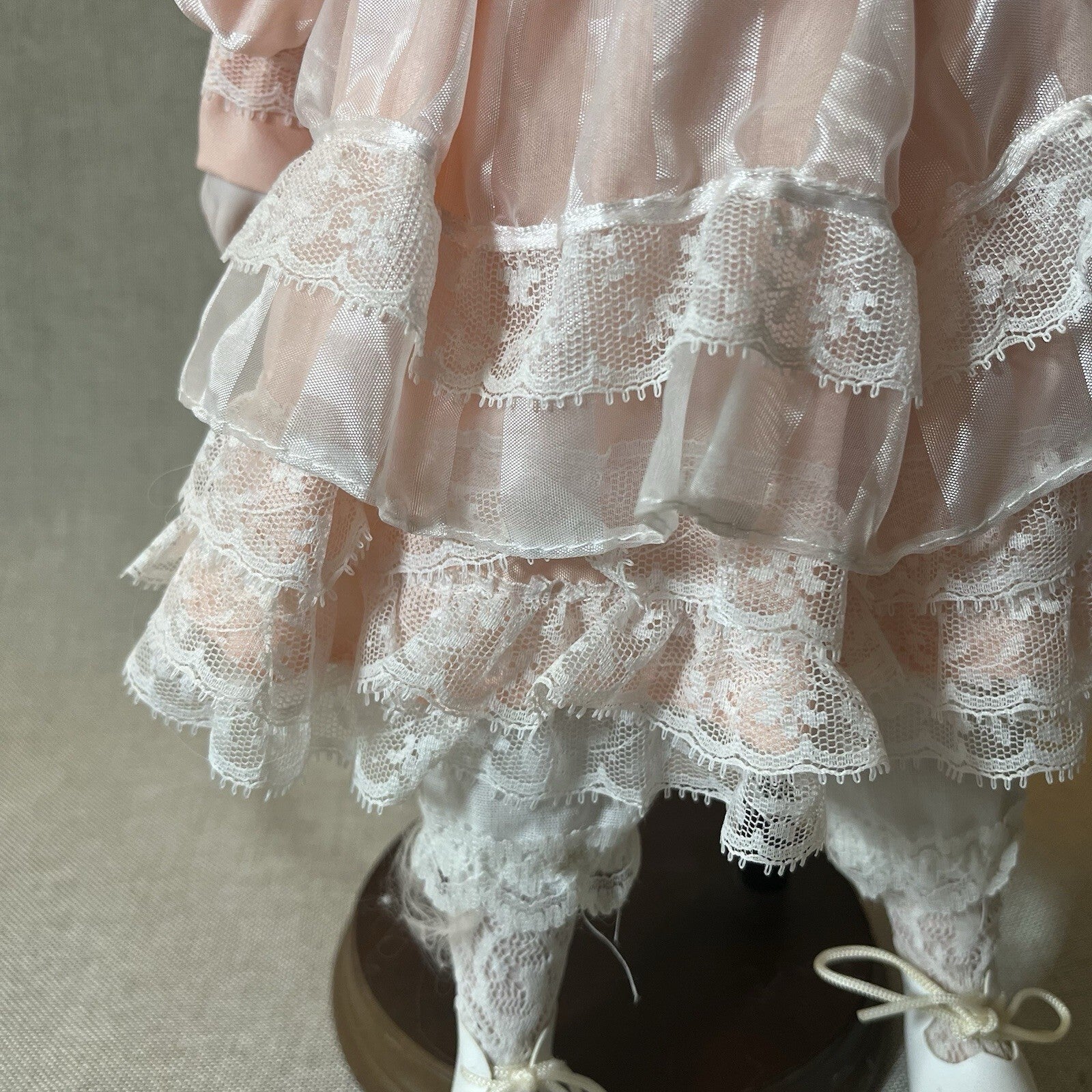 Dynasty doll collection. Porcelain Doll pink Ruffle dress.  17”